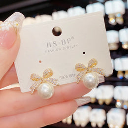 Rhinestone Bow Pearl Studs